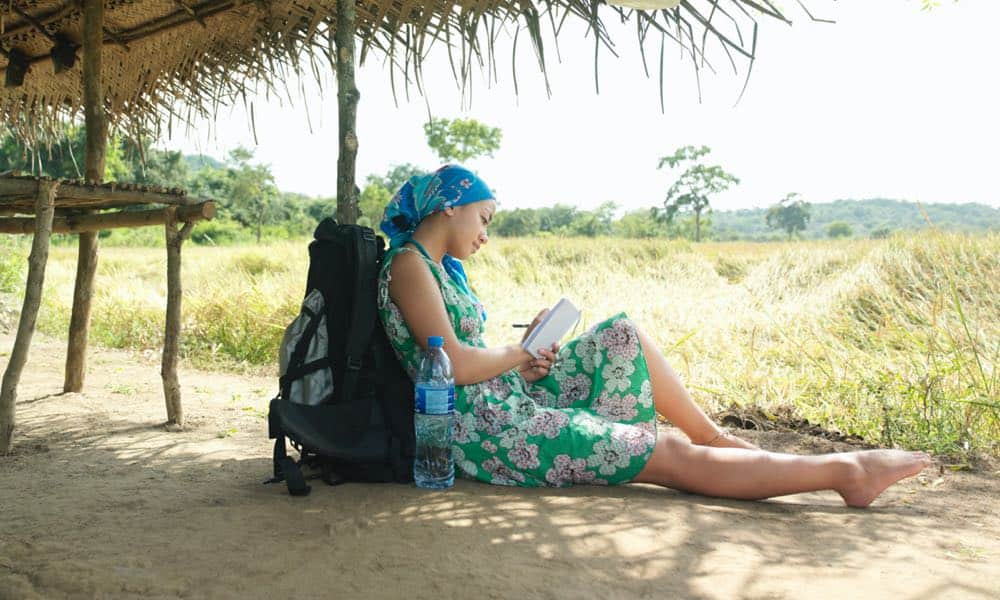 woman on vacation writing diary