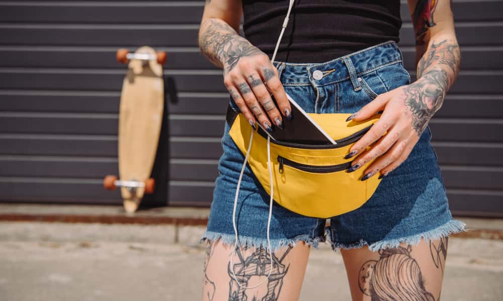 tattoo girl wearing yellow waist bag